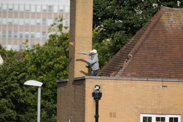 Police have been trying to negotiate with the man on the roof (Photograph: Eddie Mitchell)