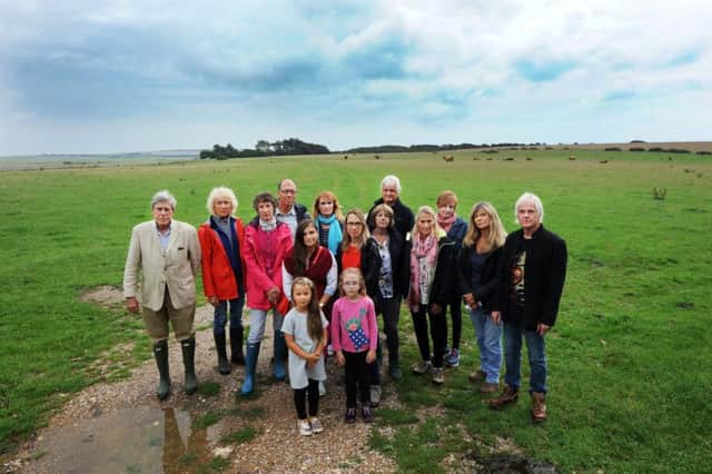 Local residents who are campaigning against a planning application to construct a road / vehicular access through a field adjacent to Crowlink Lane (Photo by Jon Rigby)