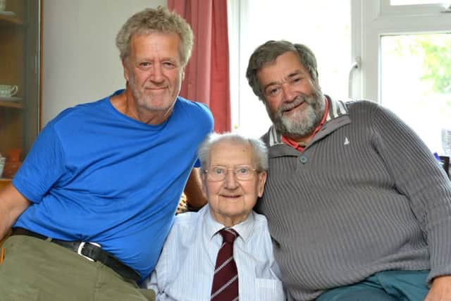 Grand century ... Arthur Howell with his sons Martin (left) and Mike