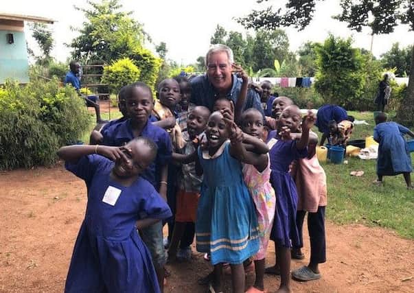 Norman Rayner with some of the children in Masindi