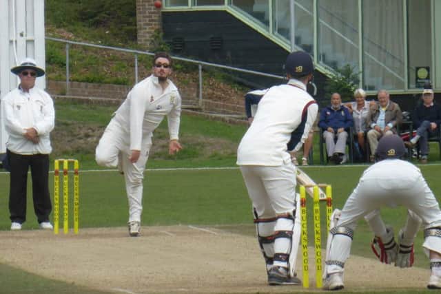 Hastings Priory spinner Jack Coleman sends a delivery on its way against Preston Nomads.
