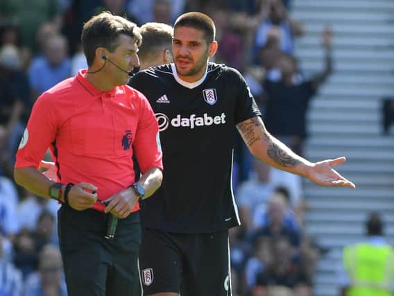 Aleksandar Mitrovic complains to referee Lee Probert about the award of Brighton's first penalty on Saturday. Picture by PW Sporting Photography
