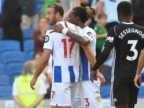 Gaetan Bong congratulates Glenn Murray on his double at full-time. Picture by PW Sporting Photography