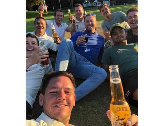 Skipper Callum Smith (front) enjoys a drink with teammates to celebrate the end of the season