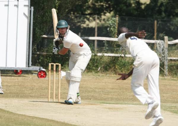 DM1870703a.jpg Cricket: Slinfold (batting) v Stirlands. Batsman Cameron Scott, bowler Jermain Bullen. Photo by Derek Martin Photography. SUS-180707-210610008