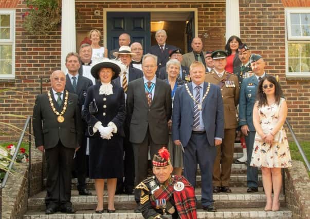 Dignitaries with the piper on the day at the Town Hall in Haywards Heath. Picture by David Ash Peake