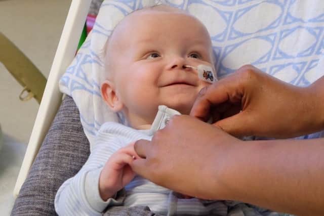 Toby was a 'happy baby' despite everything, his parents said