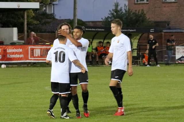 Pagham celebrate one of their six goals against East Preston / Picture by Roger Smith