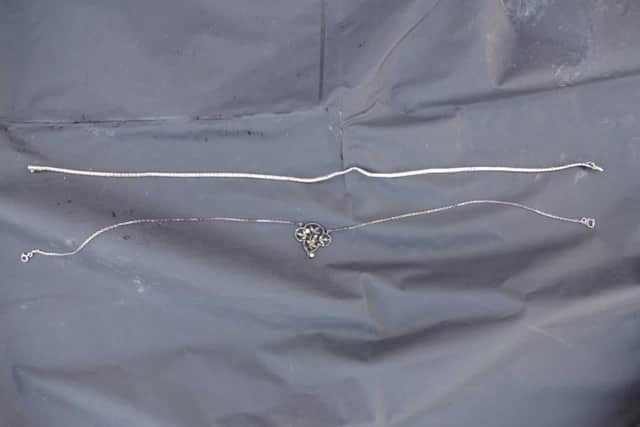 The jewellery the woman was wearing when she was found