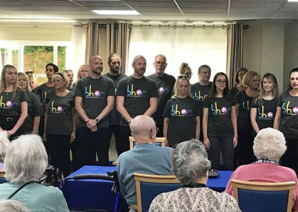 The BHOS Musical Theatre Choir performing at RNIB Wavertree House in Hove