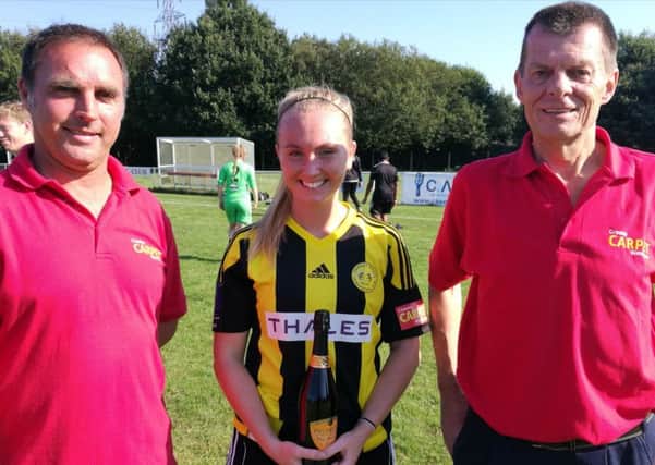 Megan Stow receives the Crawley Wasps player of the match award from sponsors Crawley Carpet Warehouse after beating Ipswich Town 8-0 in the FA Women's National League Cup SUS-180309-183950002