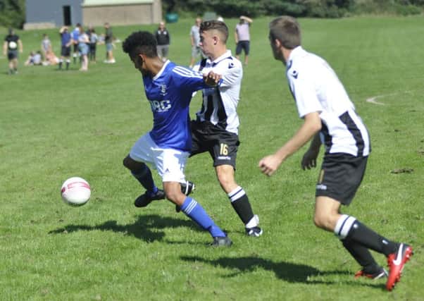 Action from the Premier Division match between St Leonards Social and Robertsbridge United. Pictures by Simon Newstead