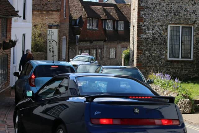 Snarl-up ... traffic in the heart of the village