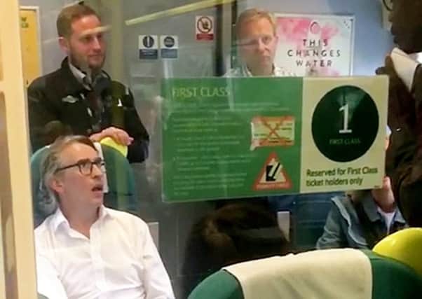 Steve Coogan remonstrating with a guard on a Southern Rail service, photo by SWNS