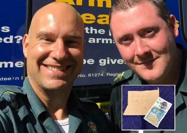 Gareth Pryor and Tom Barlow, and, inset, the Â£5 note and message which was left on their ambulance windscreen