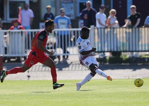 Daniel Ajakaiye scores his second goal of the game and ninth of the season during Hastings United's 3-0 win at home to Phoenix Sports last weekend. Picture courtesy Scott White