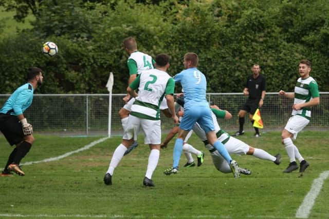Horsham's goal is put in by Corinthian defender James Bath on Saturday. Picture by John Lines
