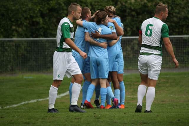 Horsham celebrate taking the lead at Corinthan. Picture by John Lines