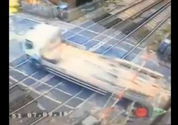 British Transport Police is seeking the identity of the driver whose lorry collided with a level crossing barrier in Battle. Picture: Southeastern