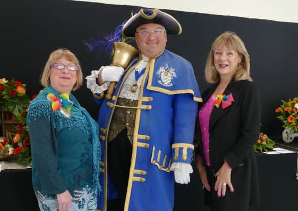 Sussex area chairman of NAFAS, Mrs. Angie Hyde; Mr. Bob Smytherman the Worthing Town Crier and Mrs. Gaenor Circus, show chairman at the Razzle Dazzle floral extravaganza at at The Henfield Hall SUS-181109-123112001