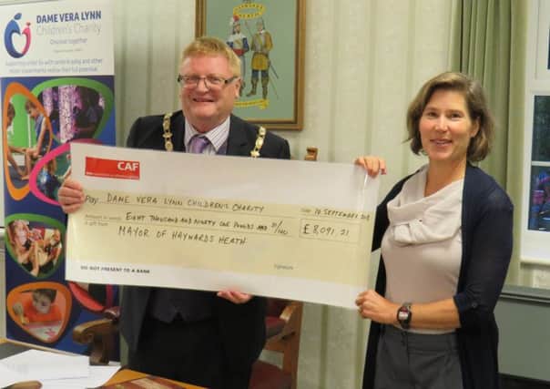 Mayor, Cllr James Knight presents Pilar Cloud with a cheque for funds raised at his Twinning Anniversary and Charity Gala Night SUS-180917-100240001