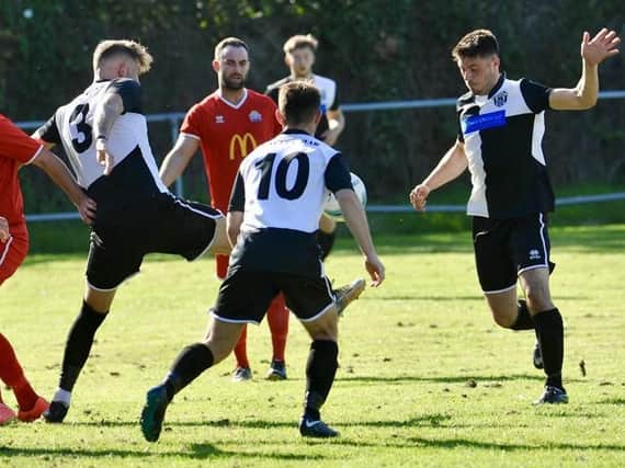 Action from East Preston's FA Vase encounter with Eastbourne United. Picture by Stephen Goodger