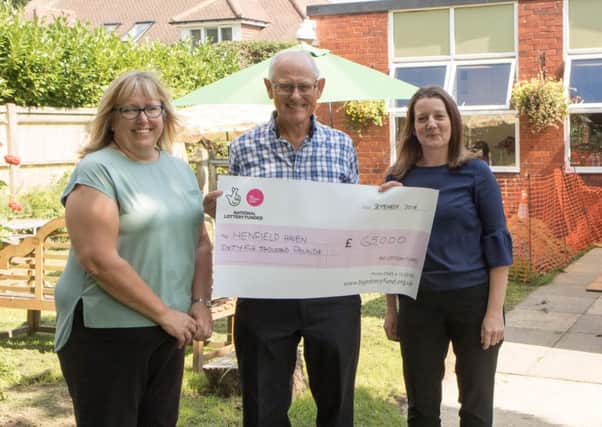 Maxine Thomas, Impact Initiatives; Tony Jackson, Henfield Social Enterprise; and Claire Webley, Big Lottery Fund with the cheque of Â£65,000 for the Henfield Haven. Â© BN5 magazine SUS-181209-122636001