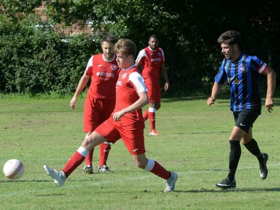 Bosham in recent action against Worthing Town / Picture by Kate Shemilt
