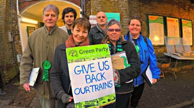 Caroline Lucas with campaigners at Preston Park station SUS-180913-101026001