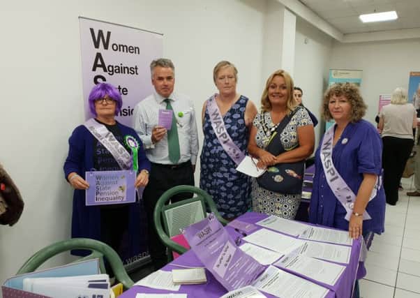 Adur District Council chairman, one from right, with the East Worthing and Shoreham MP and members of Women Against State Pension Inequality (WASPI)