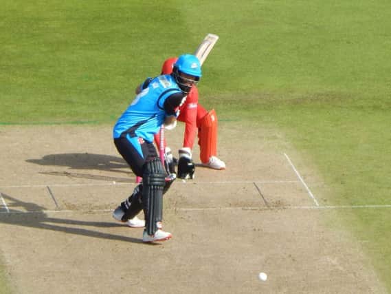 Moeen Ali hits a six against Lancashire
