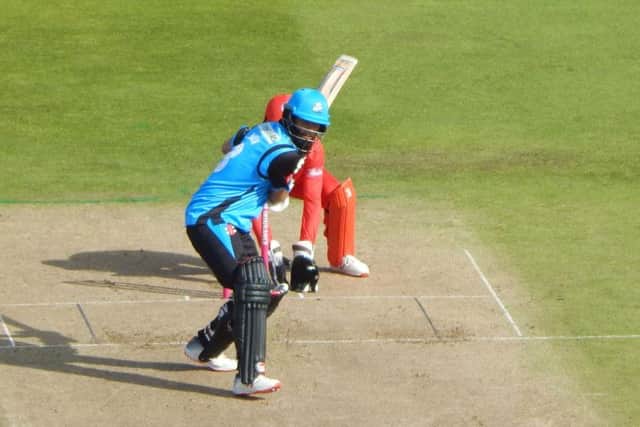 Moeen Ali hits a six against Lancashire