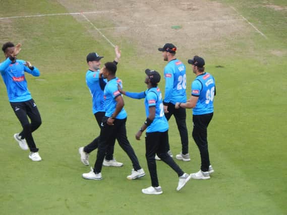 Sussex celebrate the wicket of Peter Trego