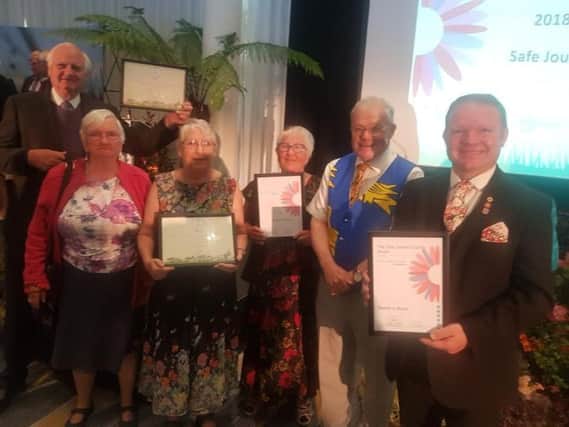 The team representing Bexhill in Bloom with their awards