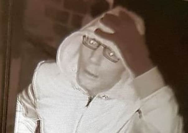 Police would like to speak to this man in connection with a break-in in Haywards Heath