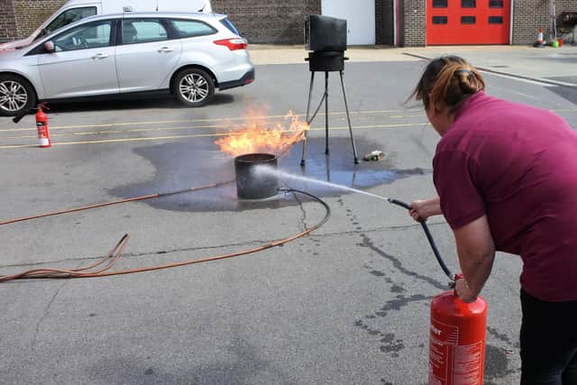 Using a water extinguisher
