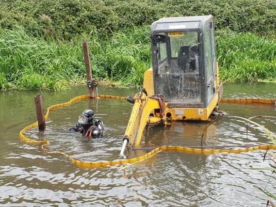 The JCB in the canal. Picture courtesy of Chichester Canal