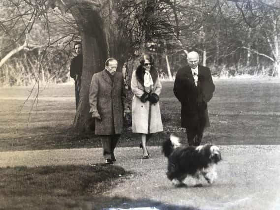 From left: Malcolm by the tree armed with a shotgun, Getty, a German baroness and  advisor Norris Bramlett.