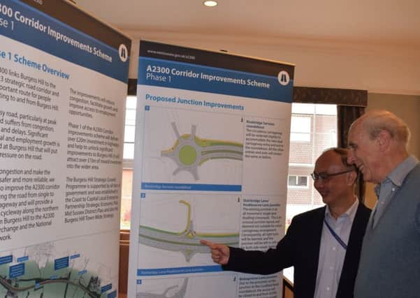 West Sussex County Council Project Manager Hiong Ching Hii, left, discusses the proposals with a resident at Tuesdays public drop-in exhibition, held at Burgess Hill Town Council's offices