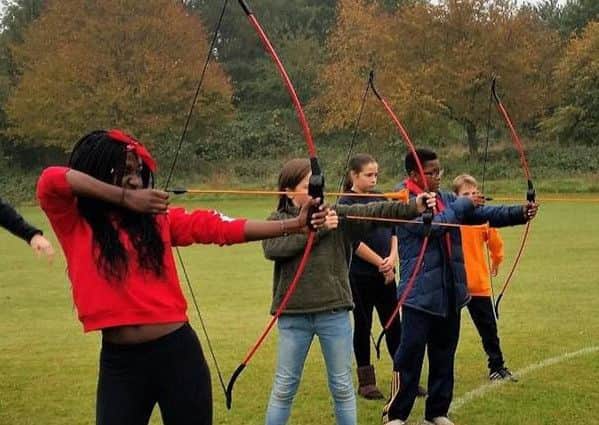 Pupils trying their hand at archery