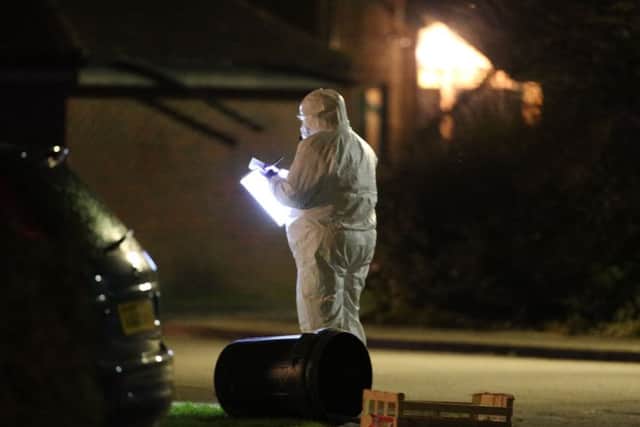 A forensic expert at the scene of the alleged attack