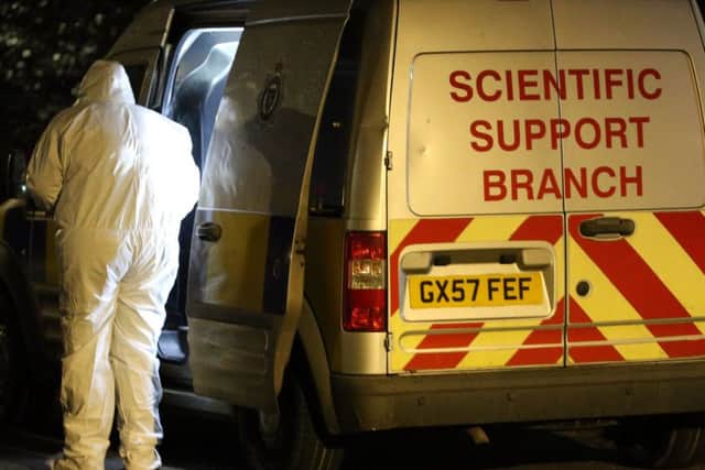 A forensic expert at the scene of the alleged attack