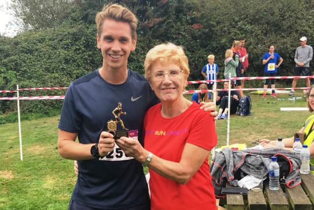Men 10k winner Sam Hubbard with Jan Sheward, founder and trustee of Cancer United