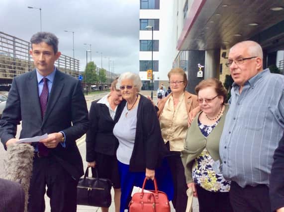 Legal representatives and Joan Blaber's family speaking outside the inquest in Brighton