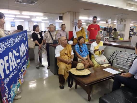 Maya and other participants on the Peace Walk talking to local government en route to Hiroshima Peace Park SUS-180925-111705001