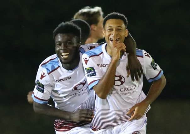 Antonio Walker (right) celebrates with Daniel Ajakaiye during Hastings United's 9-2 win over East Grinstead Town on Tuesday night. Picture courtesy Scott White