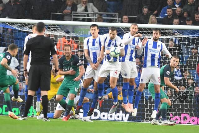 Kieran Trippier's free kick is about to hit Glenn Murray's arm. Picture by PW Sporting Photography