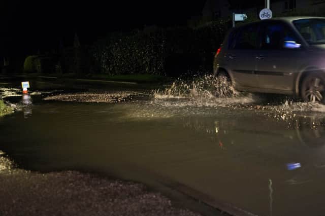 The waterlogged road. Picture by Eddie Howland SUS-180923-120257001