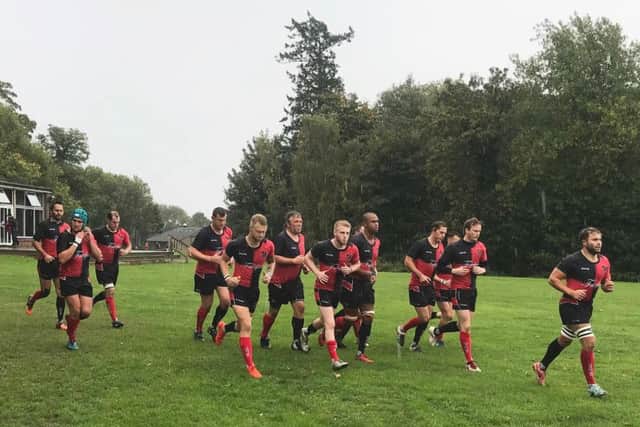 1st XV Captain Sam Drage led his team onto the pitch at Whitemans Green in challenging playing conditions for both sides