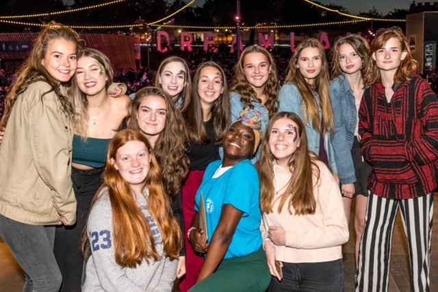 This group of girls look like they are enjoying the festivities